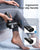 A person uses the Renpho Active Massage Gun on their leg while seated, with the leg resting on the opposite knee. The image highlights the ergonomic, non-slip handle of this deep tissue massage device. Inset images compare the featured handle to a less ergonomic alternative. Text reads, "Ergonomic Non-slip Handle" and "Skin-friendly Material, Easy to Grip.